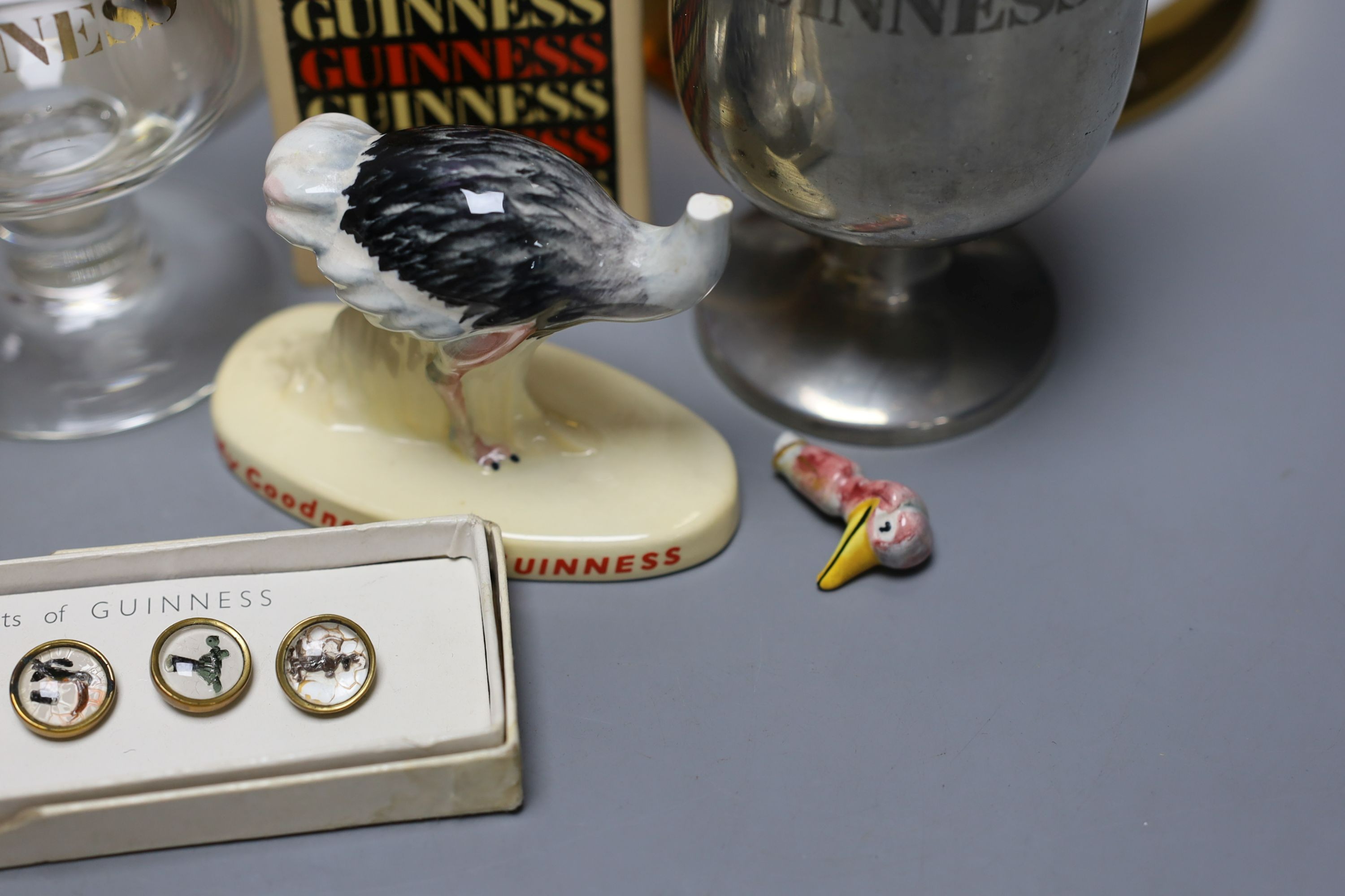 Assorted Guiness memorabilia, a Bells porcelain bottle of whisky, commemorative to the 60th birthday of Her Majesty Queen Elizabeth II